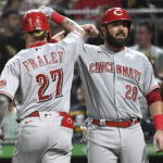 
              Cincinnati Reds' Jake Fraley is greeted by teammate Austin Romine (28) after his two-run home run off Pittsburgh Pirates pitcher Tyler Beede scored them both during the fourth inning of a baseball game, Saturday, Aug. 20, 2022, in Pittsburgh. (AP Photo/Philip G. Pavely)
            
