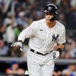 
              New York Yankees' Aaron Judge tosses his bat after hitting a home run during the fourth inning of a baseball game against the New York Mets Tuesday, Aug. 23, 2022, in New York. (AP Photo/Frank Franklin II)
            