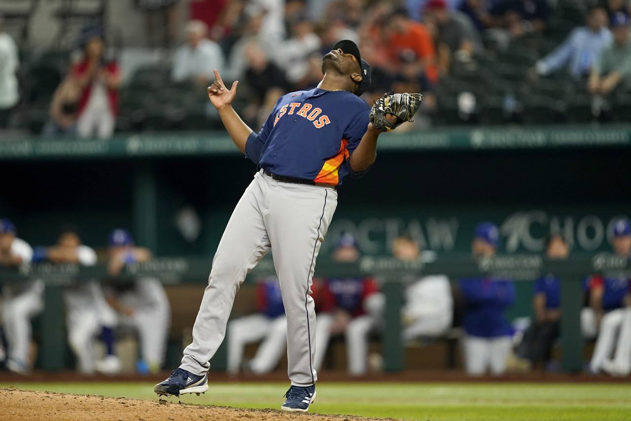 Houston Astros' Hector Neris celebrates the final out in the team's 4-2 win in a baseball game agai...