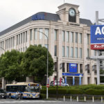 
              This photo shows the headquarters of Aoki Holdings Inc., a clothing company, in Yokohama, near Tokyo Wednesday, Aug. 17, 2022. A former Tokyo Olympic organizing committee board member and three people from the clothing company that was a surprise sponsor of the 2020 Games were arrested on bribery suspicions Wednesday. (Kyodo News via AP)
            