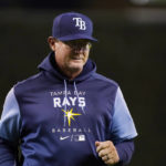 
              Tampa Bay Rays pitching coach Kyle Snyder walks back to the dugout after a mound visit during the ninth inning of the team's baseball game against the Detroit Tigers, Thursday, Aug. 4, 2022, in Detroit. Snyder injured himself walking toward the mound to visit Shane McClanahan during the seventh inning of the team's 9-1 loss to the Tigers on Saturday. The 44-year-old Snyder had to return to the dugout, and manager Kevin Cash went out to speak with McClanahan instead. (AP Photo/Carlos Osorio)
            