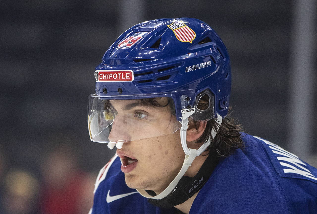 USA's Matt Knies (89) wears nose plugs after being injured against Sweden during second period IIHF...