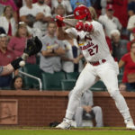 
              Colorado Rockies catcher Brian Serven, left, reaches for the ball after St. Louis Cardinals' Tyler O'Neill (27) was hit by a pitch with the bases loaded to score Andrew Knizner ending a baseball game Tuesday, Aug. 16, 2022, in St. Louis. The Cardinals won 5-4. (AP Photo/Jeff Roberson)
            