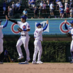 
              The Chicago Cubs from left, Nico Hoerner, Seiya Suzuki, Nick Madrigal and Rafael Ortega celebrate the team's 4-2 win over the Washington Nationals after a baseball game Wednesday, Aug. 10, 2022, in Chicago. (AP Photo/Charles Rex Arbogast)
            
