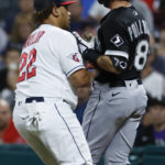
              Cleveland Guardians first baseman Josh Naylor, left, tags out Chicago White Sox's AJ Pollock during the first inning of a baseball game Saturday, Aug. 20, 2022, in Cleveland. (AP Photo/Ron Schwane)
            