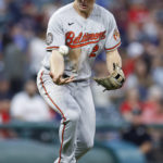 
              Baltimore Orioles third baseman Gunnar Henderson fields the ball and throws out Andres Gimenez at first base in his Major League debut during the sixth inning of a baseball game Wednesday, Aug. 31, 2022, in Cleveland. (AP Photo/Ron Schwane)
            