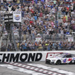 
              Kevin Harvick (4) crosses the finish line to win a NASCAR Cup Series auto race at Richmond Raceway, Sunday, Aug. 14, 2022, in Richmond, Va. (AP Photo/Steve Helber)
            