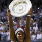 
              FILE - Serena Williams of the United States reacts as she holds the trophy after winning the women's singles final against Garbine Muguruza of Spain, at the All England Lawn Tennis Championships in Wimbledon, London, Saturday July 11, 2015. Saying “the countdown has begun,” 23-time Grand Slam champion Serena Williams announced Tuesday, Aug. 9, 2022, she is ready to step away from tennis so she can turn her focus to having another child and her business interests, presaging the end of a career that transcended sports. (AP Photo/Kirsty Wigglesworth, File)
            