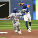 
              Toronto Blue Jays shortstop Bo Bichette, right, throws to first base to complete a double play on Chicago Cubs' Willson Contreras after forcing out Nick Madrigal (1) at second base during the first inning of a baseball game Tuesday, Aug. 30, 2022, in Toronto. (Jon Blacker/The Canadian Press via AP)
            