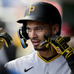 
              Pittsburgh Pirates' Tucupita Marcano celebrates in the dugout after scoring on a sacrifice bunt by Greg Allen during the fourth inning of a baseball game against the Philadelphia Phillies, Sunday, Aug. 28, 2022, in Philadelphia. (AP Photo/Derik Hamilton)
            