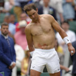 
              FILE - Spain's Rafael Nadal sports tape on his stomach following a medical timeout as he plays Taylor Fritz of the US in a men's singles quarterfinal match on day ten of the Wimbledon tennis championships in London, Wednesday, July 6, 2022. Nadal has withdrawn from the upcoming hard-court tournament in Montreal because of the abdominal injury that caused him to pull out of Wimbledon ahead of the semifinals. The Spaniard had been 19-0 in Grand Slam matches this year when he decided the injury was too much at Wimbledon.(AP Photo/Kirsty Wigglesworth, File)
            
