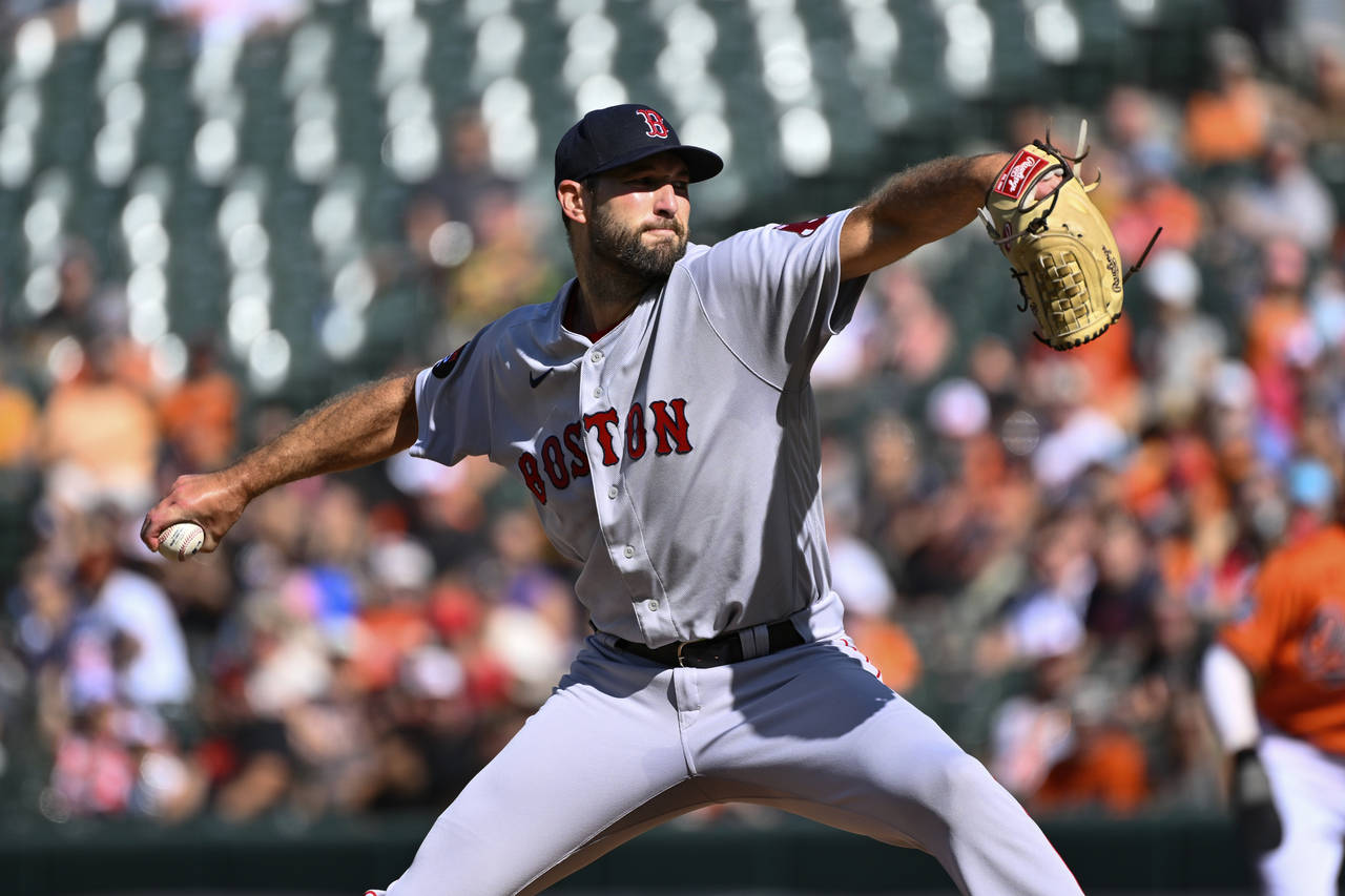 Boston Red Sox starting pitcher Michael Wacha throws during the first inning of a baseball game aga...