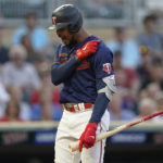 
              Minnesota Twins' Byron Buxton reacts after striking out to end the bottom of the fifth inning of a baseball game against the Texas Rangers, Monday, Aug. 22, 2022, in Minneapolis. (AP Photo/Abbie Parr)
            