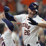 
              Houston Astros' Trey Mancini (26) celebrates with Jose Altuve after hitting a two-run home run against the Minnesota Twins during the sixth inning of a baseball game Wednesday, Aug. 24, 2022, in Houston. (AP Photo/David J. Phillip)
            