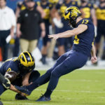 
              FILE - Michigan place kicker Jake Moody kicks a field goal against Georgia during the first half of the Orange Bowl NCAA College Football Playoff semifinal game, Friday, Dec. 31, 2021, in Miami Gardens, Fla. Moody was selected to The Associated Press preseason All-America team Monday, Aug. 22, 2022. (AP Photo/Lynne Sladky, File)
            
