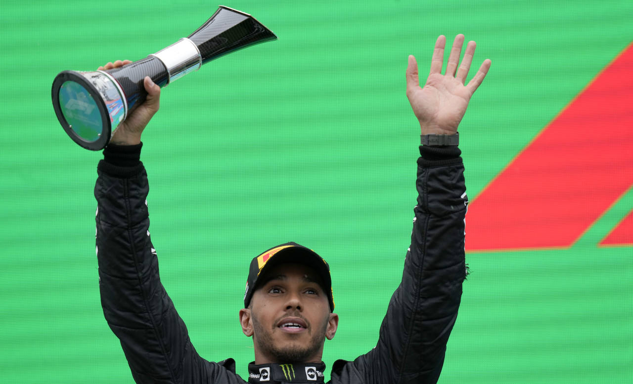 Second placed Mercedes driver Lewis Hamilton of Britain celebrates on the podium after the Hungaria...