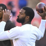 
              Cleveland Browns quarterback Jacoby Brissett (7), right, warms up beside Deshaun Watson prior to an NFL preseason football game against the Chicago Bears, Saturday, Aug. 27, 2022, in Cleveland. (AP Photo/David Richard)
            
