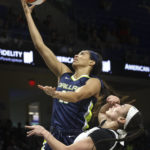 
              Dallas Wings forward Isabelle Harrison shoots while defended by Las Vegas Aces forward Dearica Hamby during the first half of a WNBA basketball game Thursday, Aug. 4, 2022, in Arlington, Texas. (Rebecca Slezak/The Dallas Morning News via AP)
            