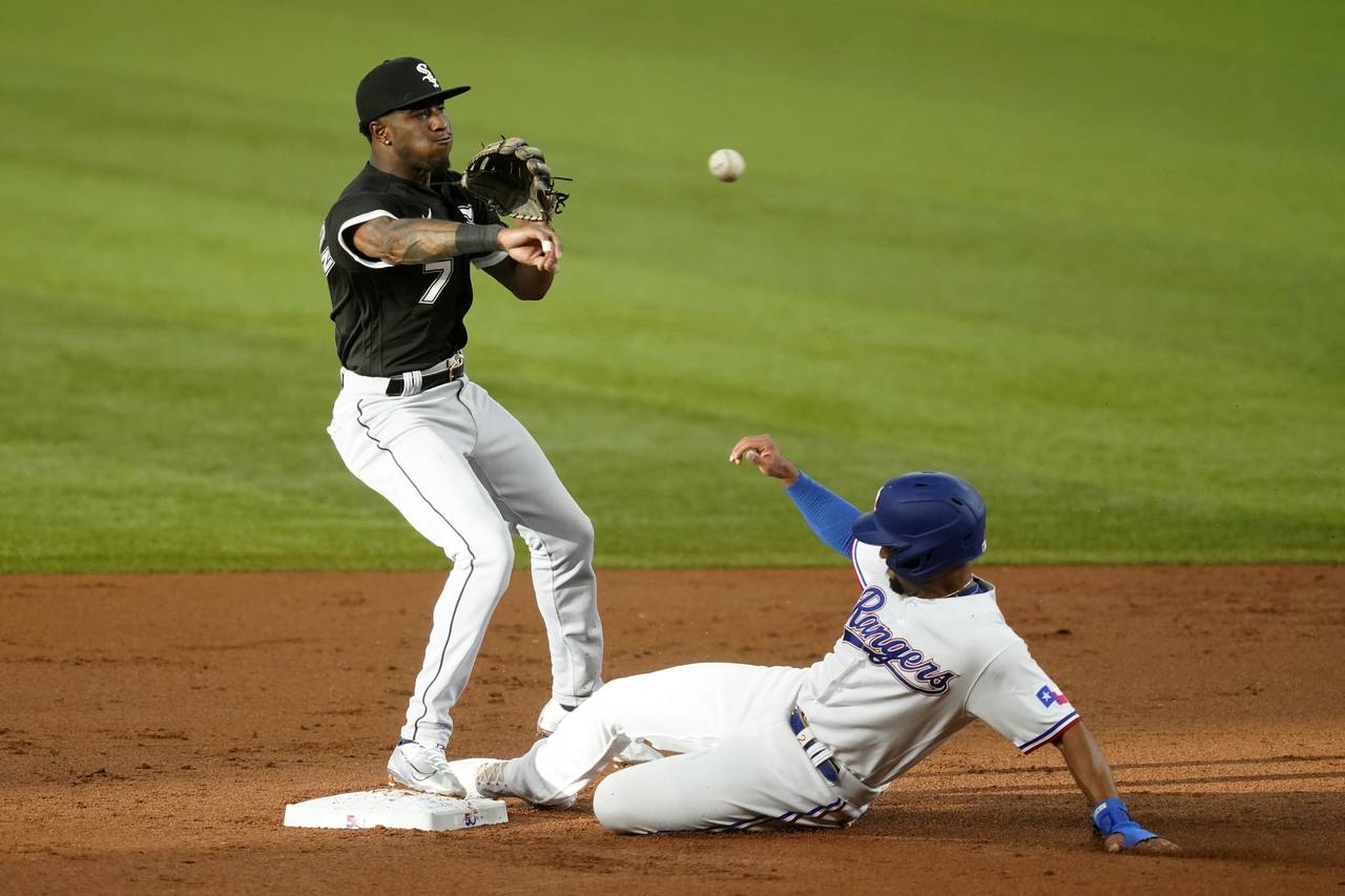Chicago White Sox shortstop Tim Anderson throw to first to complete the double play after forcing T...