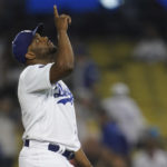 
              Los Angeles Dodgers relief pitcher Hanser Alberto (17) points to the sky after a baseball game against the Milwaukee Brewers in Los Angeles, Tuesday, Aug. 23, 2022. TheDodgers won 10-1. (AP Photo/Ashley Landis)
            