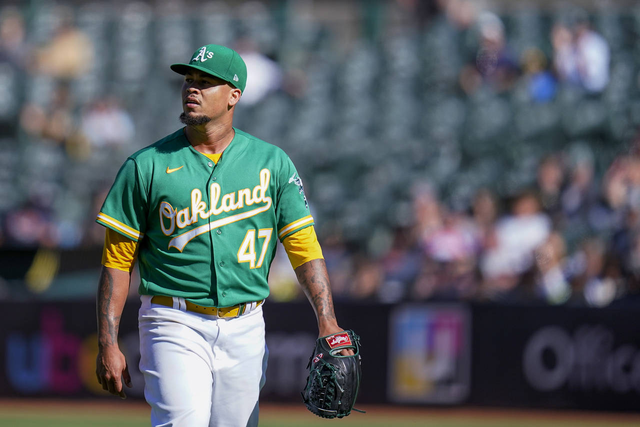 Oakland Athletics' Frankie Montas walks to the dugout after pitching against the Detroit Tigers dur...