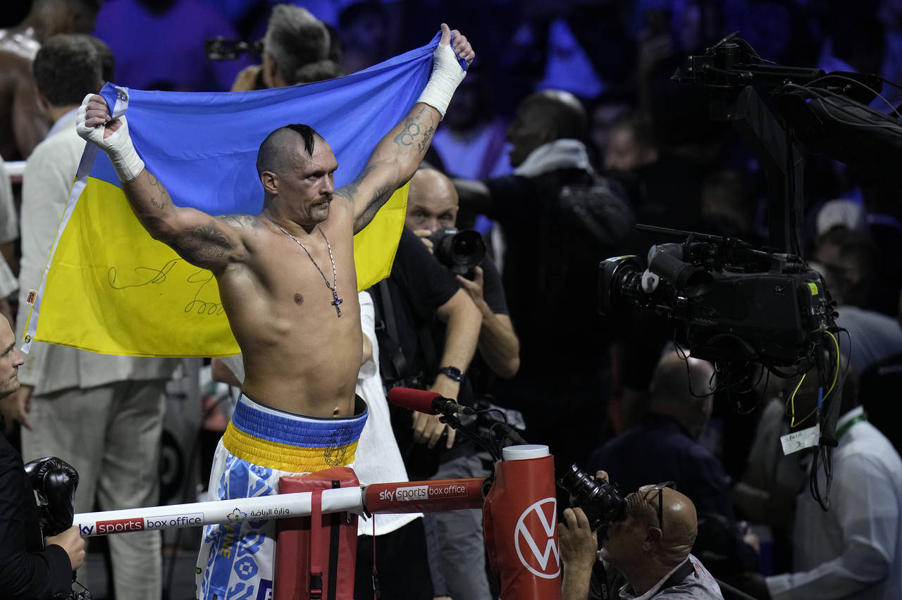 Ukraine's Oleksandr Usyk celebrates after beating Britain's Anthony Joshua to retain his world heav...