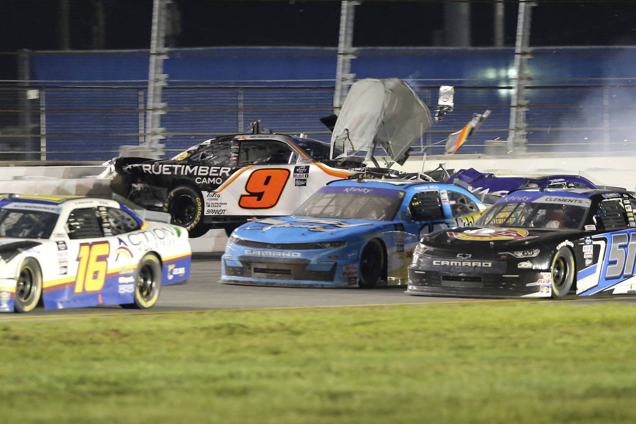 Noah Gragson (9) is spun around going into Turn 3 on the back stretch during a NASCAR Xfinity Serie...