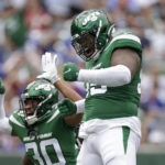 
              New York Jets defensive lineman Quinnen Williams, right, celebrates after sacking New York Giants quarterback Tyrod Taylor in the first half of a preseason NFL football game, Sunday, Aug. 28, 2022, in East Rutherford, N.J. (AP Photo/Adam Hunger)
            