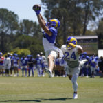 
              Los Angeles Rams wide receiver Cooper Kupp, left, and Los Angeles Rams defensive back Taylor Rapp (24) participate in a drill during NFL football training camp in Irvine, Calif., Saturday, Aug. 6, 2022. (AP Photo/Ashley Landis)
            