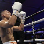 
              Teofimo Lopez celebrates after defeating Pedro Campa by TKO in a junior welterweight boxing match, Saturday, Aug. 13, 2022, in Las Vegas. (AP Photo/John Locher)
            