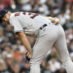 
              Houston Astros starting pitcher Justin Verlander checks the runner at first during the second inning of the team's baseball game against the Chicago White Sox on Tuesday, Aug. 16, 2022, in Chicago. (AP Photo/Charles Rex Arbogast)
            