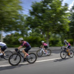 
              Yang Lan, second from left, and other members of the Qiyi bicycle club ride along a rural road during a group ride through the Baihe River Canyon in the northern outskirts of Beijing, Wednesday, July 13, 2022. Cycling has gained increasing popularity in China as a sport. A coronavirus outbreak that shut down indoor sports facilities in Beijing earlier this year encouraged people to try outdoor sports including cycling, which was only a major tool of transport before 2000. (AP Photo/Mark Schiefelbein)
            