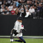 
              Las Vegas Raiders wide receiver Tyron Johnson (1) makes a catch during the first half of an NFL preseason football game against the New England Patriots, Friday, Aug. 26, 2022, in Las Vegas. (AP Photo/John Locher)
            