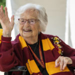 
              Sister Jean Dolores Schmidt waves to Loyola students, faculty, alumni and reporters, during her 103rd birthday celebration at Sister Jean Dolores Schmidt, BVM Plaza next to the Loyola Red Line station in Chicago, Sunday, Aug. 21, 2022. (Tyler Pasciak LaRiviere/Chicago Sun-Times via AP)
            