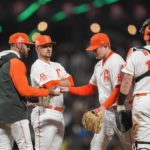 
              San Francisco Giants starting pitcher Logan Webb, second from right, is pulled from the team's baseball game against the San Diego Padres by manager Gabe Kapler, left, during the sixth inning in San Francisco, Tuesday, Aug. 30, 2022. (AP Photo/Godofredo A. Vásquez)
            