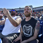 
              From left, Jon Greenbaum of Wayland, Mass., and Tommy Berryment of Dover, N.H., react to a play during the game between the Portland Sea Dogs and the Hartford Yard Goats, Sunday, August 28, 2022, at Hadlock Field in Portland, Maine. Across the northeastern U.S., outdoor businesses are profiting from the unusually dry weather. (AP Photo/Josh Reynolds)
            