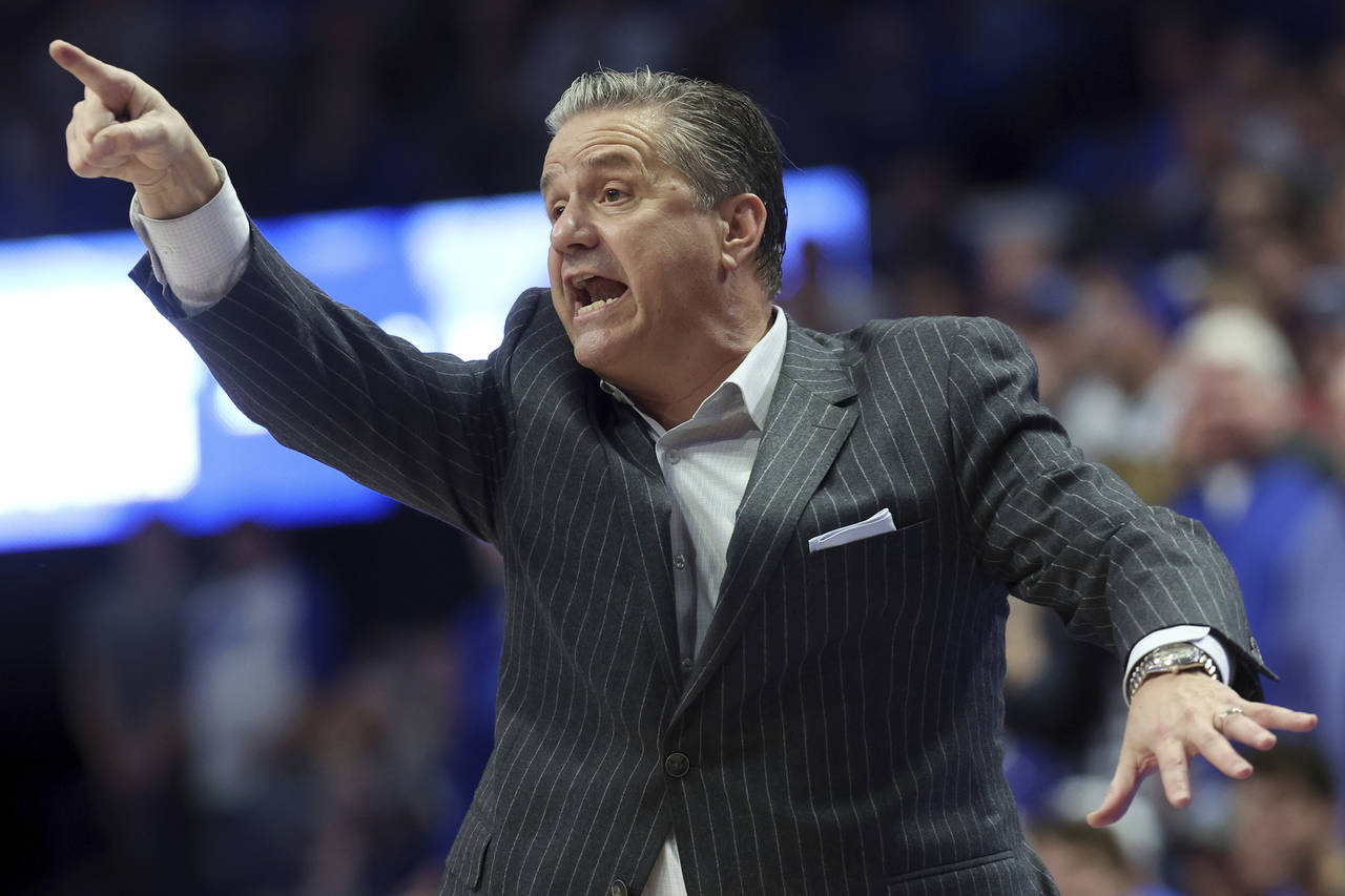 FILE - Kentucky coach John Calipari gestures during the second half of the team's NCAA college bask...