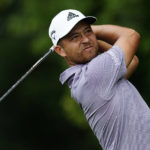 
              Xander Schauffele hits off the second tee during the first round of the Tour Championship golf tournament at East Lake Golf Club, Thursday, Aug. 25, 2022, in Atlanta. (AP Photo/John Bazemore)
            
