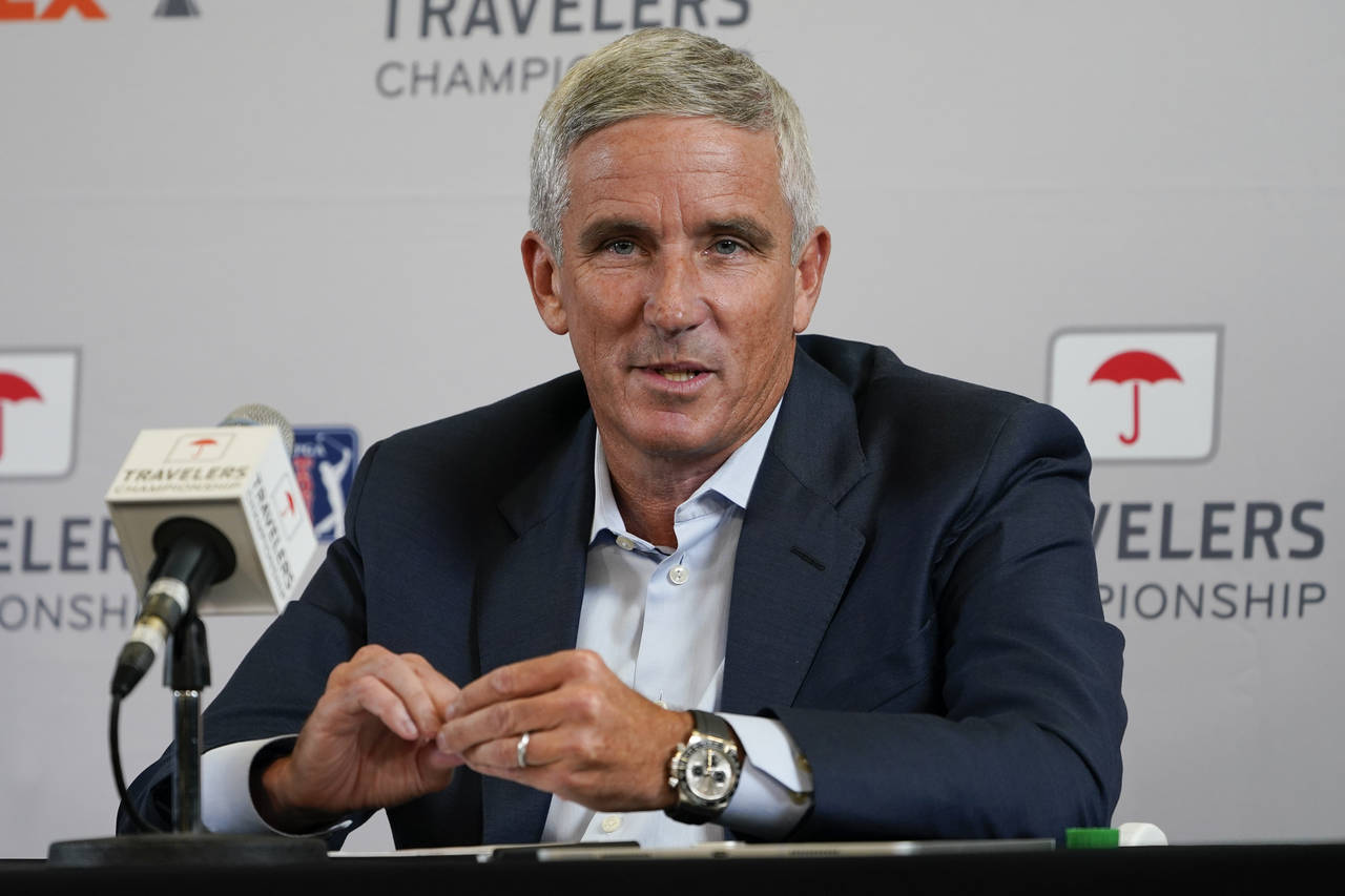 FILE - PGA Tour Commissioner Jay Monahan speaks during a news conference before the Travelers Champ...