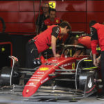 
              Pit crew work in the garage of Ferrari driver Charles Leclerc of Monaco prior to the first practice session ahead of the Formula One Grand Prix at the Spa-Francorchamps racetrack in Spa, Belgium, Friday, Aug. 26, 2022. The Belgian Formula One Grand Prix will take place on Sunday. (AP Photo/Olivier Matthys)
            