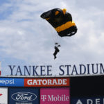 
              Members of the U.S. Army Golden Knights parachute into Yankee Stadium before a baseball game between the Toronto Blue Jays and the New York Yankees. Saturday, Aug. 20, 2022, in New York. (AP Photo/Noah K. Murray)
            