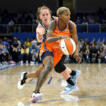 
              Connecticut Sun's Courtney Williams drives past Chicago Sky's Emma Meesseman during the first half of Game 2 in a WNBA basketball playoffs semifinal Wednesday, Aug. 31, 2022, in Chicago. (AP Photo/Nam Y. Huh)
            