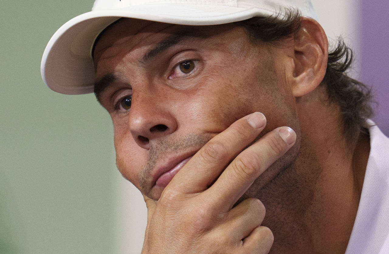 FILE - Spain's Rafael Nadal announces that he is withdrawing from the semi-final of the Gentlemen's...