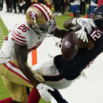 
              San Francisco 49ers cornerback Samuel Womack III (26) breaks up a pass intended for Houston Texans wide receiver Nico Collins (12) during the first half of an NFL football game Thursday, Aug. 25, 2022, in Houston. Womack was called for pass interference on the play. (AP Photo/David J. Phillip)
            