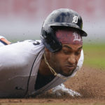 
              Detroit Tigers' Victor Reyes slides into third base for a two-run triple against the Los Angeles Angels in the fourth inning of a baseball game in Detroit, Sunday, Aug. 21, 2022. (AP Photo/Paul Sancya)
            