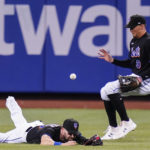 
              New York Mets' Tyler Naquin, left, and Brandon Nimmo, right, attempt to gain control of a ball hit by Philadelphia Phillies' Bryson Stott for a single during the fourth inning of a baseball game Friday, Aug. 12, 2022, in New York. (AP Photo/Frank Franklin II)
            