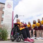 
              Sister Jean sits in front of the newly renamed Sister Jean Dolores Schmidt, BVM Plaza which sits next to the Loyola Red Line station, during Sister Jean's 103rd birthday celebration in Chicago, Sunday, Aug. 21, 2022. (Tyler Pasciak LaRiviere/Chicago Sun-Times via AP)
            