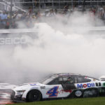 
              Kevin Harvick (4) does a burnout as he celebrates after winning a NASCAR Cup Series auto race at Richmond Raceway, Sunday, Aug. 14, 2022, in Richmond, Va. (AP Photo/Steve Helber)
            