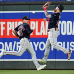 
              Boston Red Sox right fielder Alex Verdugo, right, commits an error attempting to make the catch on  a ball hit by Minnesota Twins' Carlos Correa during the fifth inning of a baseball game Tuesday, Aug. 30, 2022, in Minneapolis. (AP Photo/Abbie Parr)
            
