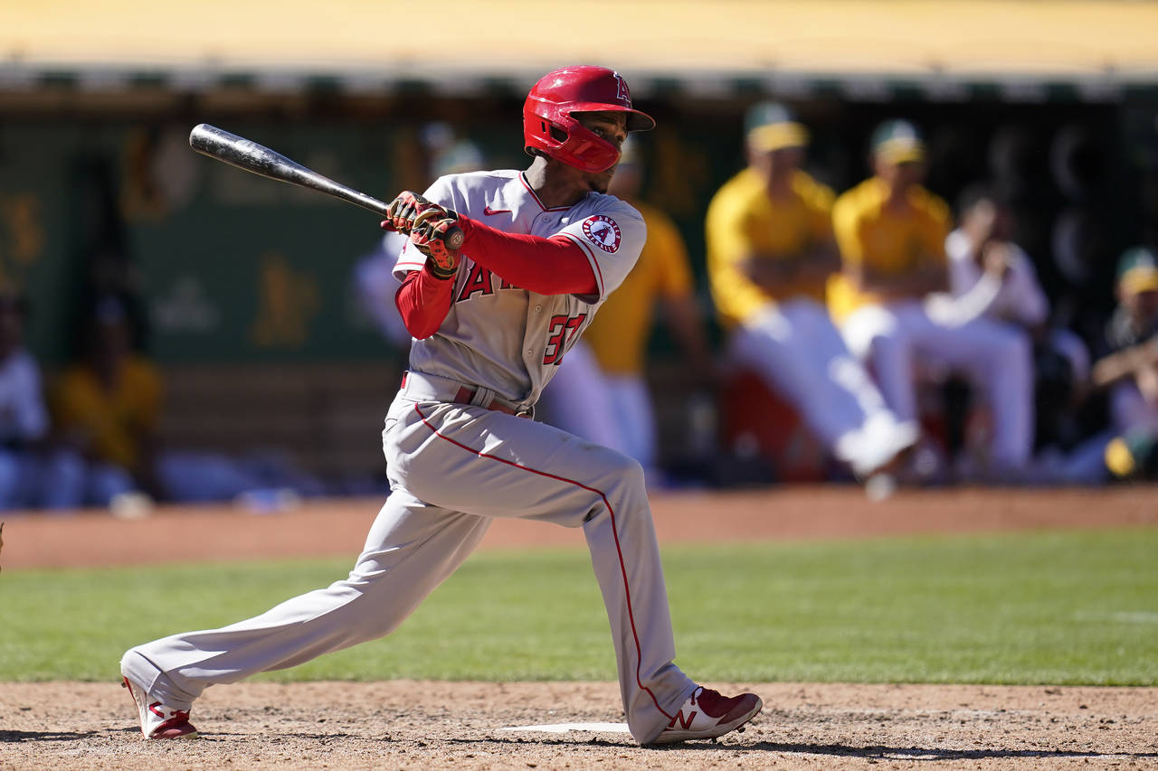 Los Angeles Angels' Magneuris Sierra watches his RBI double during the twelfth inning of a baseball...